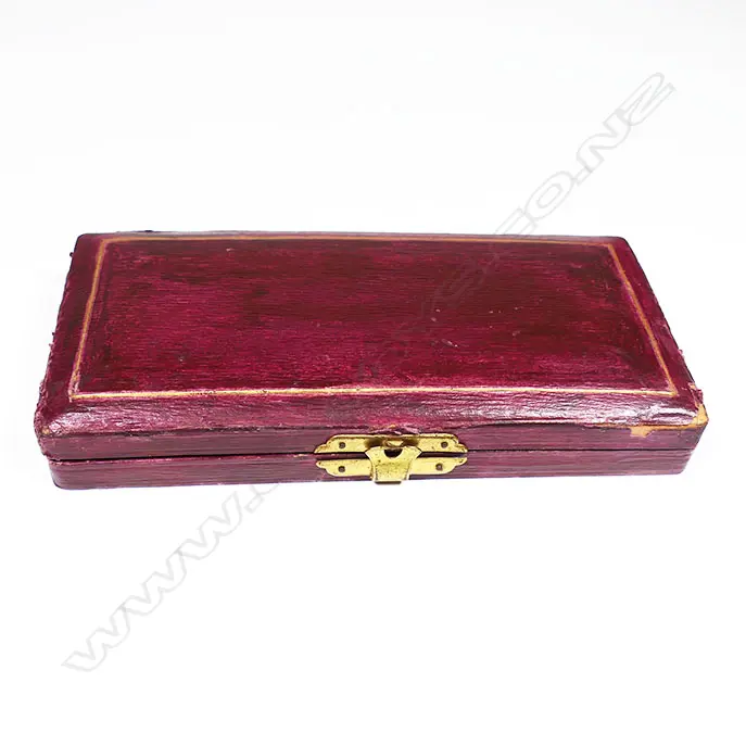 A red morocco cased sewing kit, with bone handled implements Image 1++