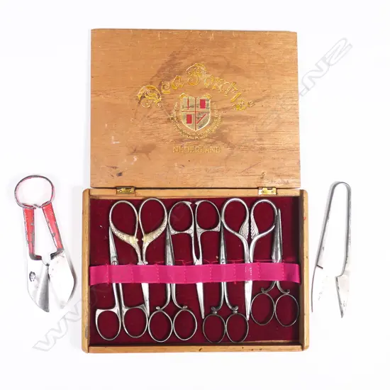 A box of seven sewing scissors and two pair of steel thread snips