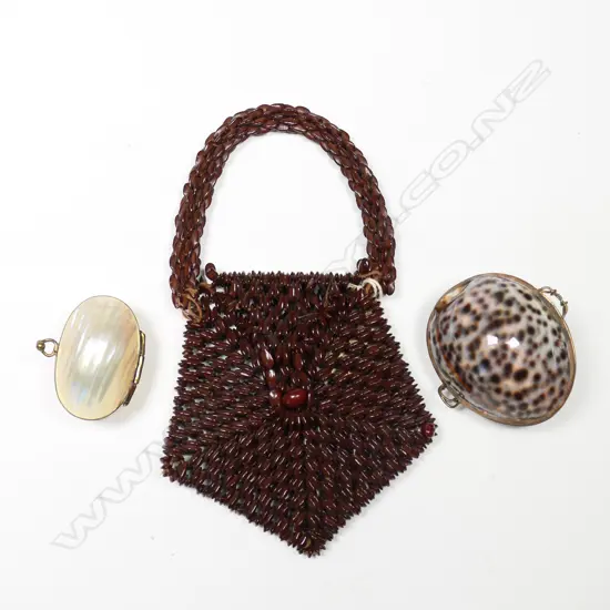 Two souvenir shell purses (tiger core and pearl turbo) and a purse made of seeds