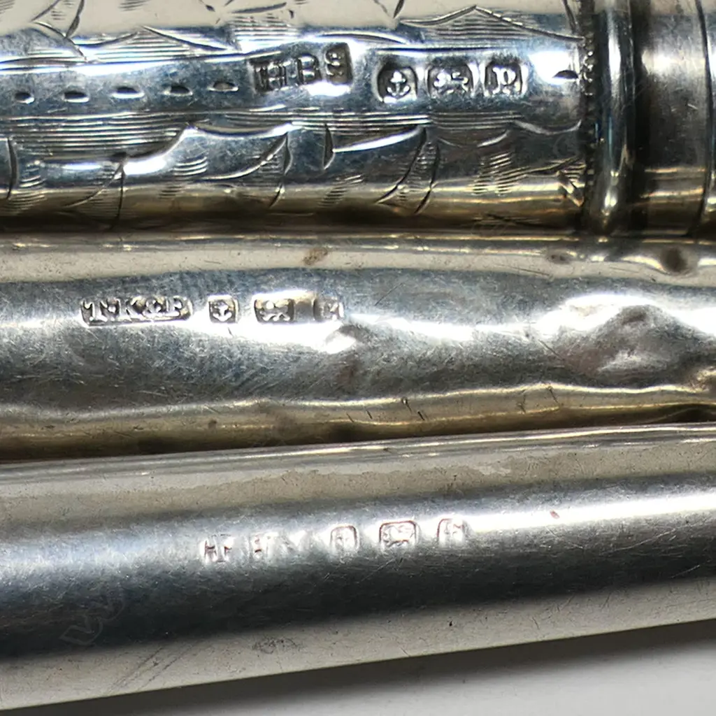 A collection of five silver cigarette holder cases, Image 1++