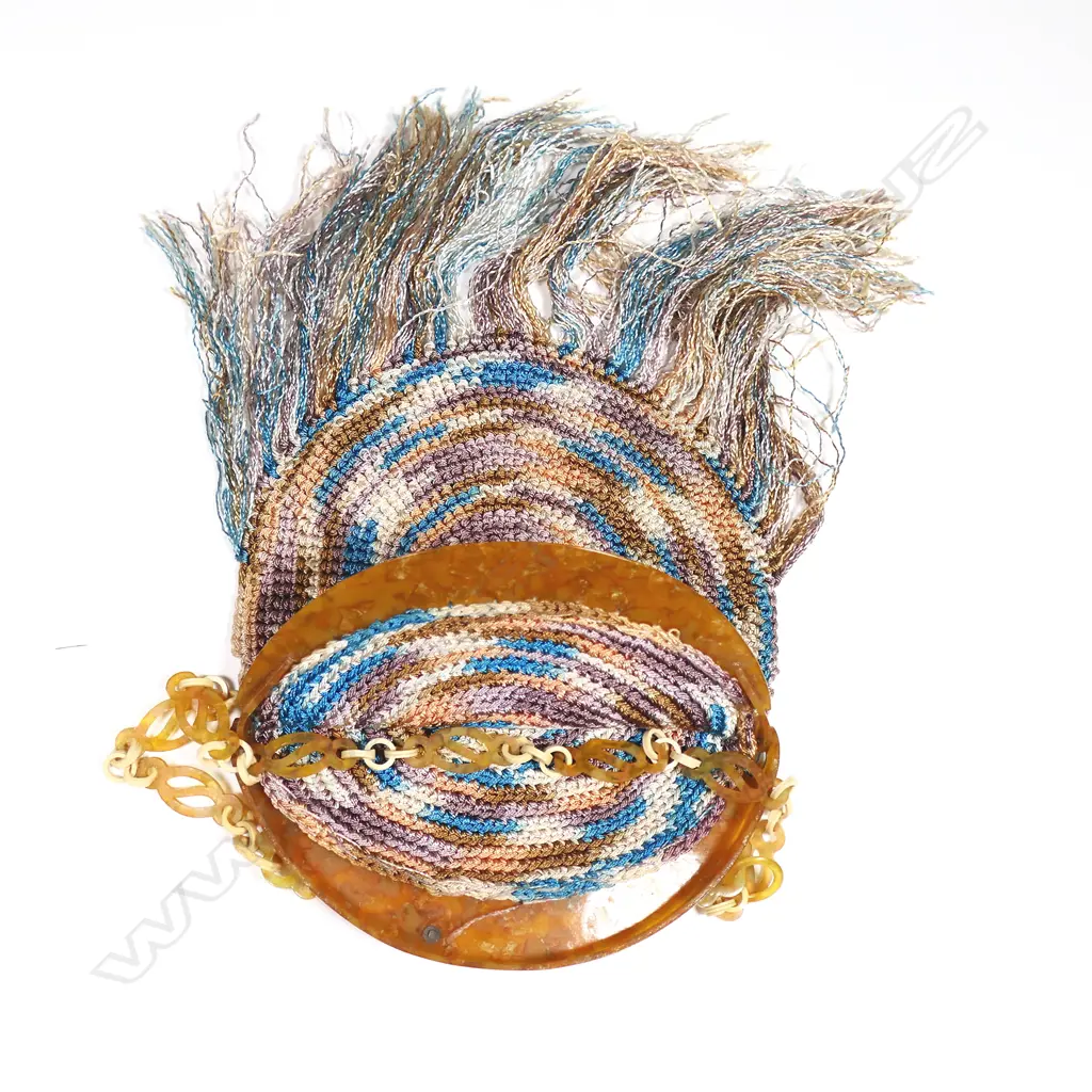 A French Art Deco period crocheted silk handbag with mottled amber plastic frame, Image 1++