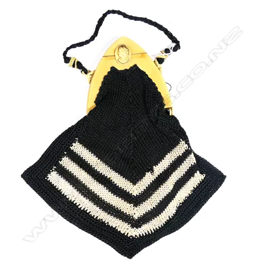 A French Art Deco ivorine framed black and white crochet handbag,