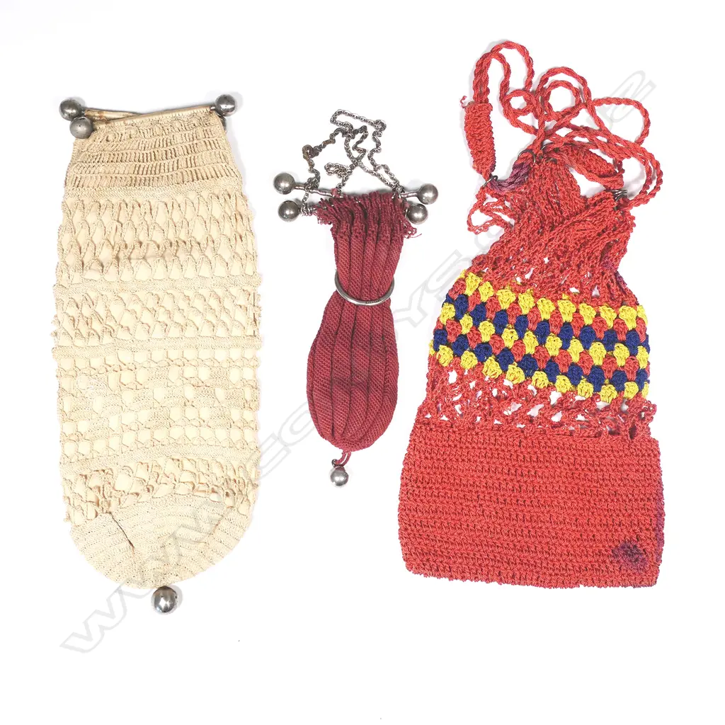 A colonial string work purse in plum red, and another in cream, with dumbbell frames, with another in bright cottons Image 1++