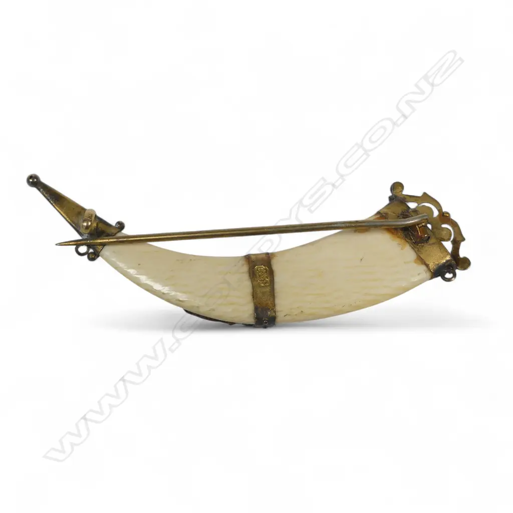 An ivory tusk shape brooch with 9ct gold MIZPAH mount and capped ends. L.60mm Image 1++