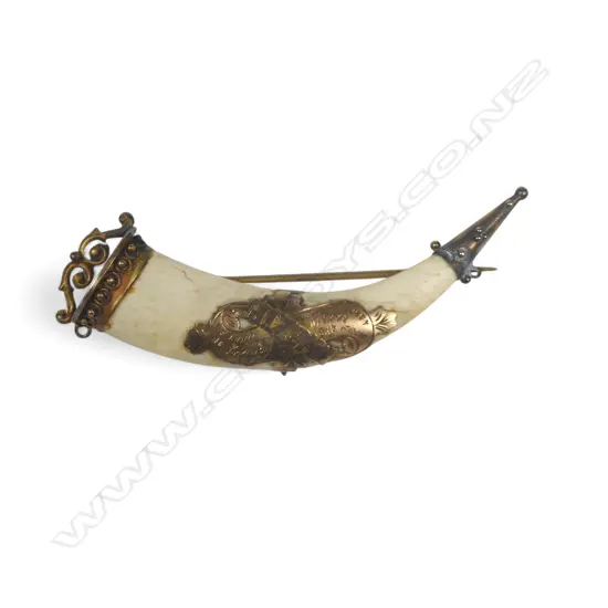An ivory tusk shape brooch with 9ct gold MIZPAH mount and capped ends. L.60mm