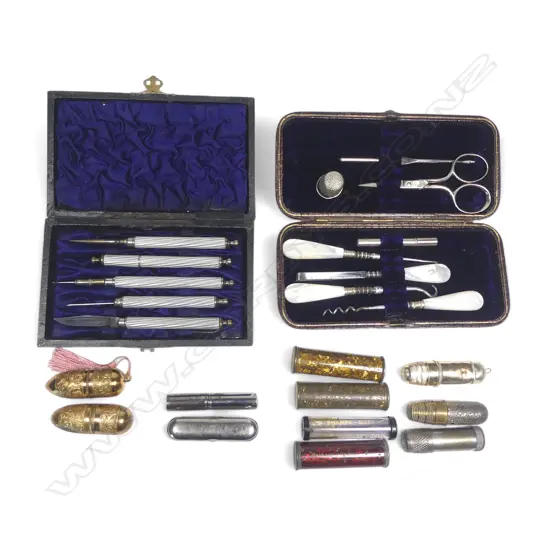 Two cased lady's sewing compendiums, leather and leatherette cased, and a collection of various tube cases holding bobbins, thimbles and needles