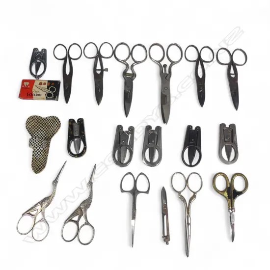 A box of various small sewing scissors, folding handle trip scissors and two 'stork' scissors.