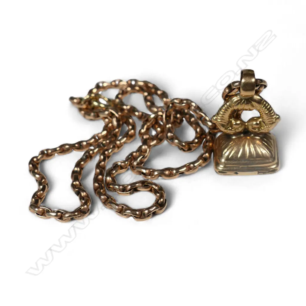 A French 14ct gold fob seal, 4gms (AF), with a 9ct gold chain, 6gms Image 1++