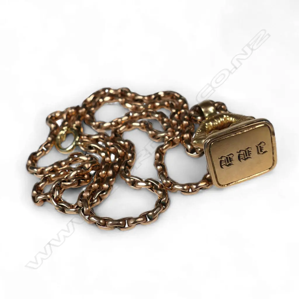 A French 14ct gold fob seal, 4gms (AF), with a 9ct gold chain, 6gms Image 1++