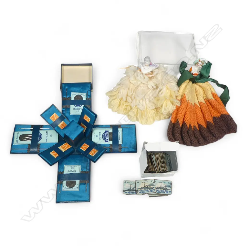 Two china half-doll mounted tea cosies, a novelty drop side box of Abel Morrell's needles, and an incomplete set of WWI period Battleship game markers Image 1++