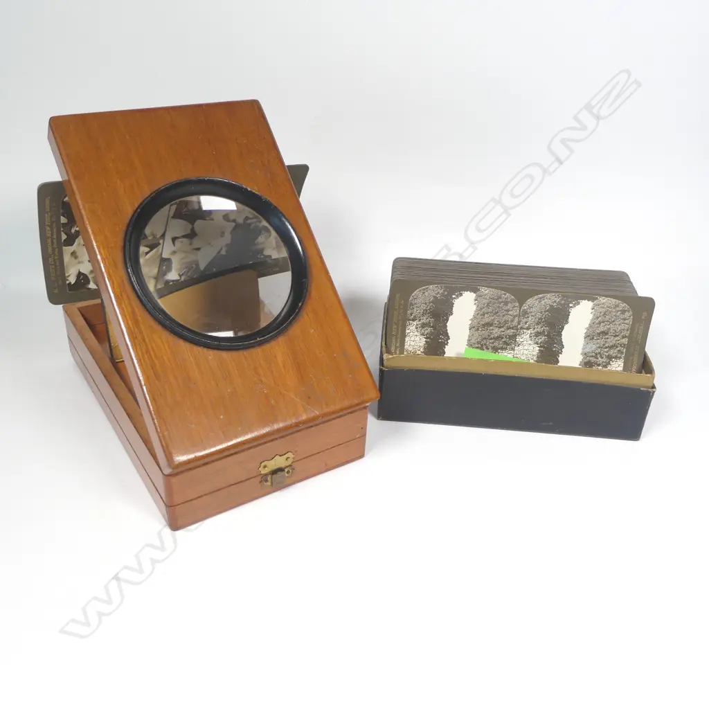 A folding tabletop magnifying photograph and cartes de visite viewer, and box stereoscope photo cards Image 1++
