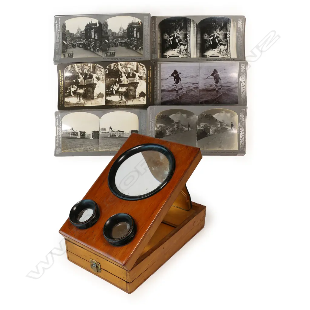 A folding tabletop magnifying stereoscopic photograph and cartes de visite viewer, plus a box of stereoscope cards, Image 1++