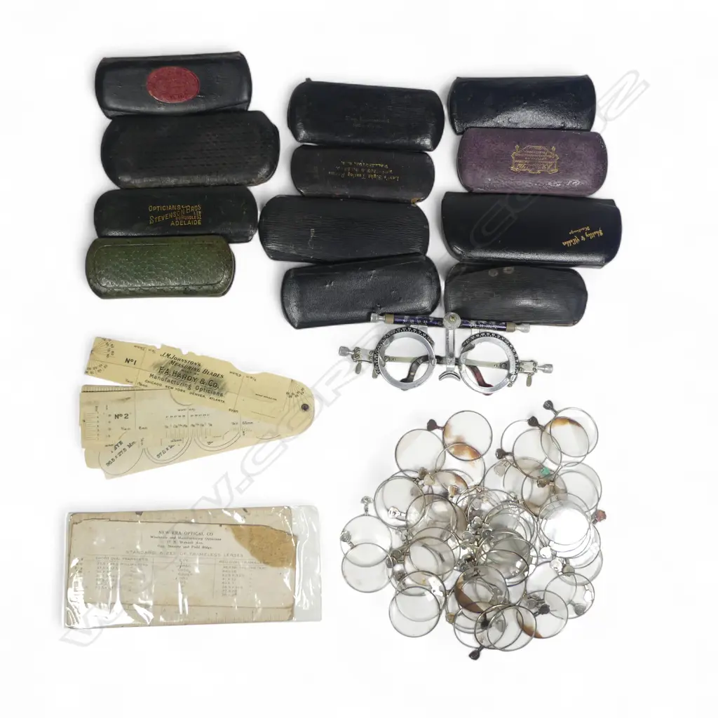 An optician's dispensing spectacles frame and collection of insert lenses, along with 12 empty named spectacles cases Image 1++