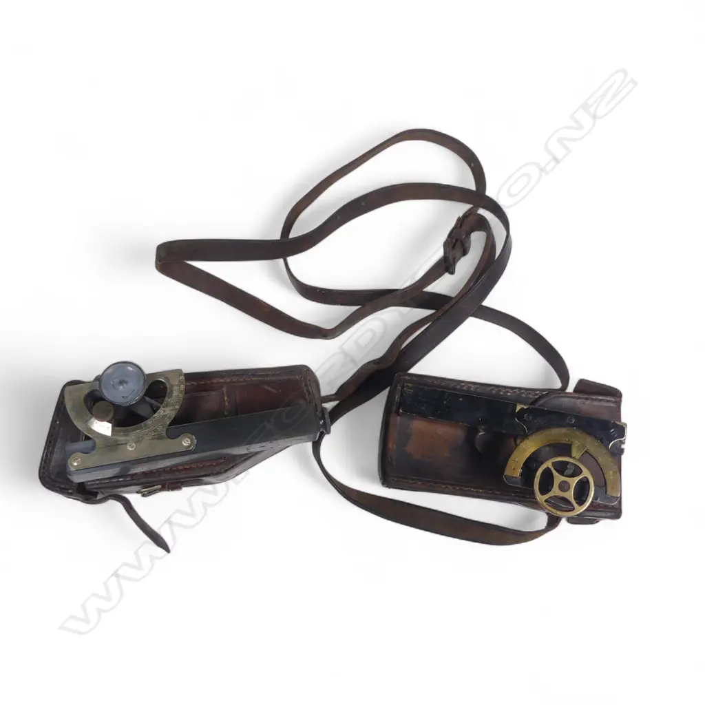 Two leather cased inclinometers, one marked Littlejohn & Sons, Wellington. Image 1++