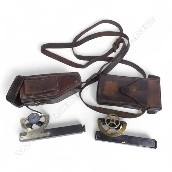 Two leather cased inclinometers, one marked Littlejohn & Sons, Wellington.