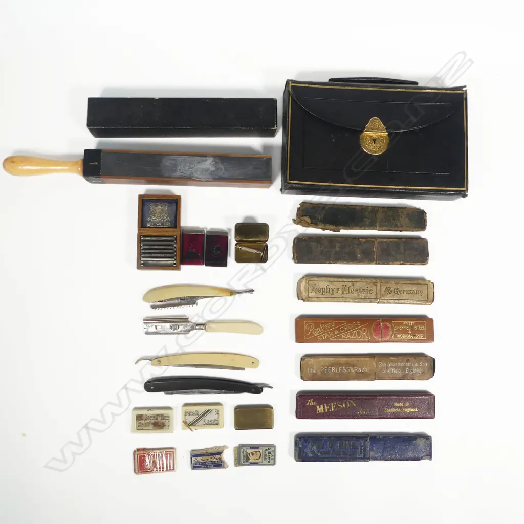 A box of cut-throat razors and others, along with a four-side paddle strop Image 1++