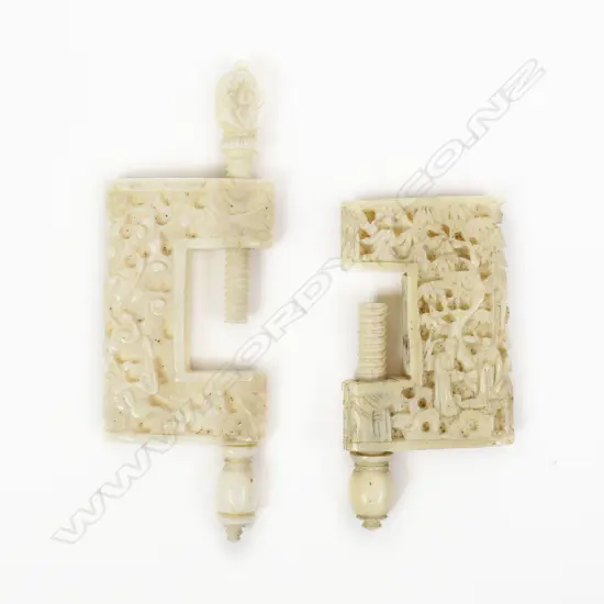 Two Chinese carved ivory sewing work clamps, one carved with flowers, the other with figures in a landscape. Body H.40mm