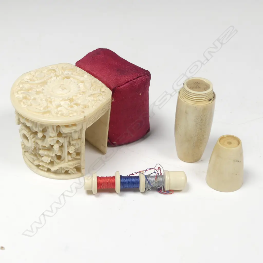 A large Chinese carved ivory sewing clamp and an ivorine bobbin case, Image 1++
