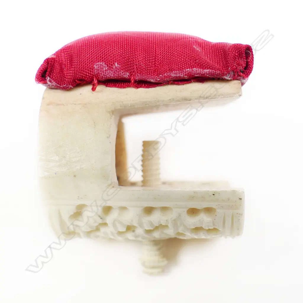 A Chinese carved ivory sewing work clamp with affixed pincushion and a bone Stanhope pincushion. Image 1++