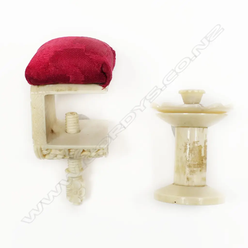 A Chinese carved ivory sewing clamp with pincushion and a bone bobbin with screw-off mother of pearl top, Image 1++