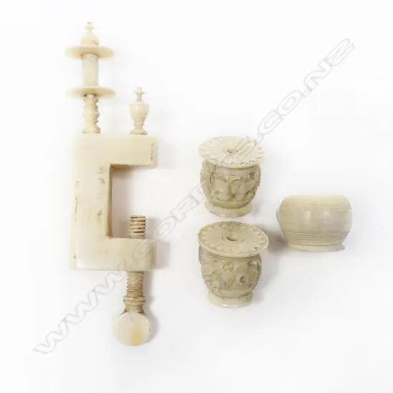 A European plain ivory sewing clamp with bobbin spindle and campana urn finial, along with three small ivory thread holders (parts)