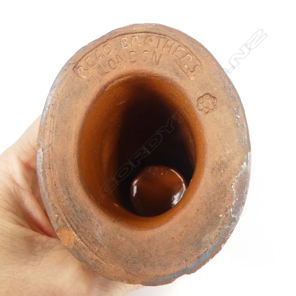 An early 20thC glazed pottery 'Dog's Head' wax vesta match holder in the form of a boxer dog advertising 'Guinness' and 'Bass', Image 1++