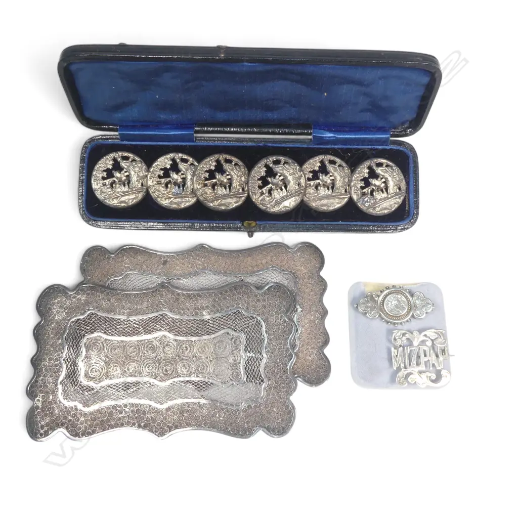 Two Oriental unmarked filigree silver? pillow end plates, two brooches and a cased set of silver plated buttons, Image 1++