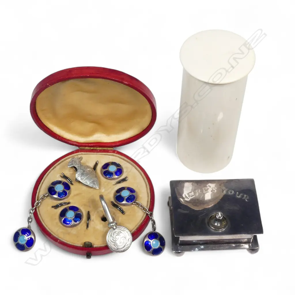 A set of American silver cufflinks and studs; two silver napkin clasps, an EP stud box and a cylindrical ivory canister, Image 1++