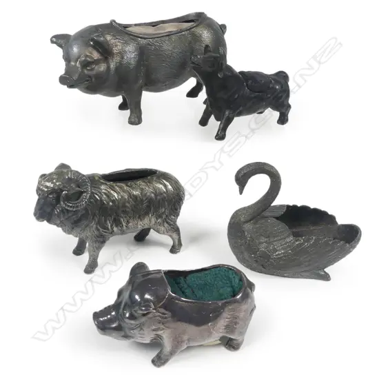 Five various cast metal animal pincushions,