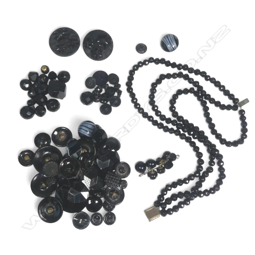 A collection of various black buttons and beads Image 1++