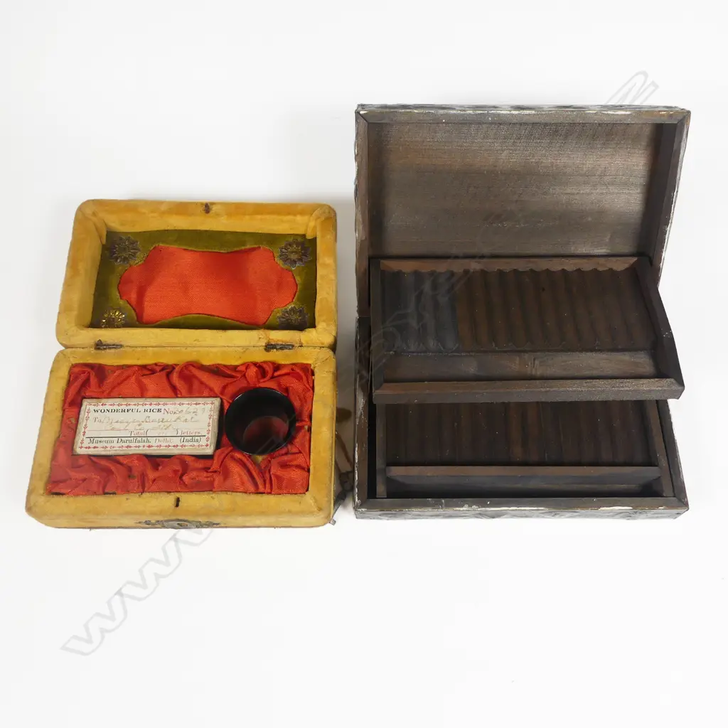 An embossed pewter Arts & Crafts style cigarette box; a microscopically inscribed grain of rice curio; a Japanese Tomi leather penguin and a Grace Seecombe kookaburra salt shaker. Image 1++