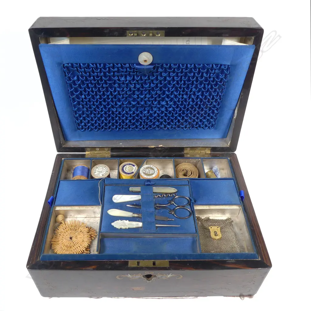 A Victorian ebony grained work box with glass reverse print inset top, (glass faulted), interior fitted with MoP handled implements and with original owner's details. W.305mm Image 1++