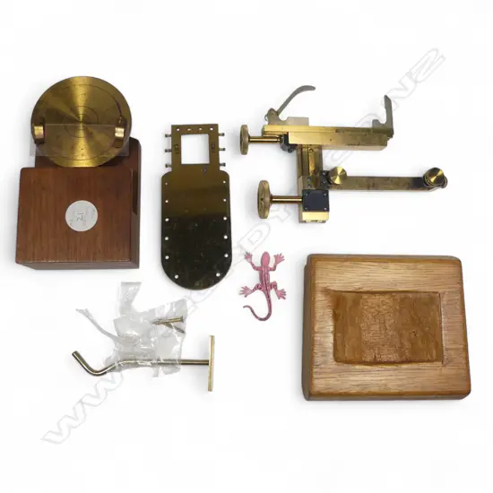 A lacquered brass mechanical microscope stage by Watson & Sons London, a brass microscope frog plate, and a rotating slide holder.