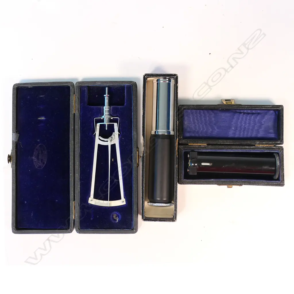 A tonometer, cased, by Weiss London (to measure the internal pressure of the eye); a cased Beck lacquered brass mono prism hand spectroscope, and an Otis King's patent Model K cylindrical slide rule, original box and instructions. Image 1++