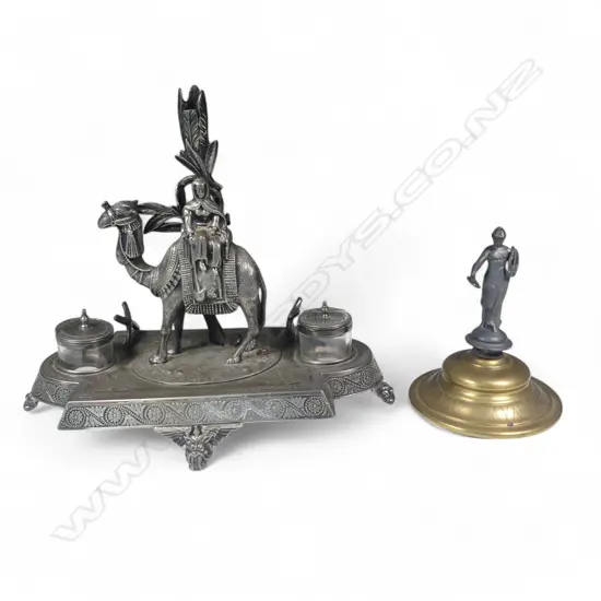 A James Deakin & Sons silver-plated desk top inkstand, surmounted by a camel and cameleer,