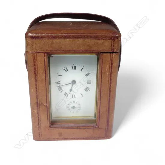 A French brass cased carriage clock in leather travel case,
