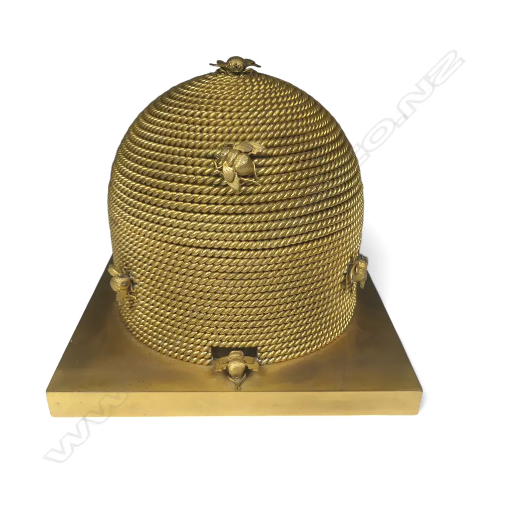 A good mid-Victorian George Betjemann & Sons gilt-metal bee skep sewing box, of classic beehive shape of straw rope twist, surmounted by bees, on a square plinth base with recessed feet. Image 1++