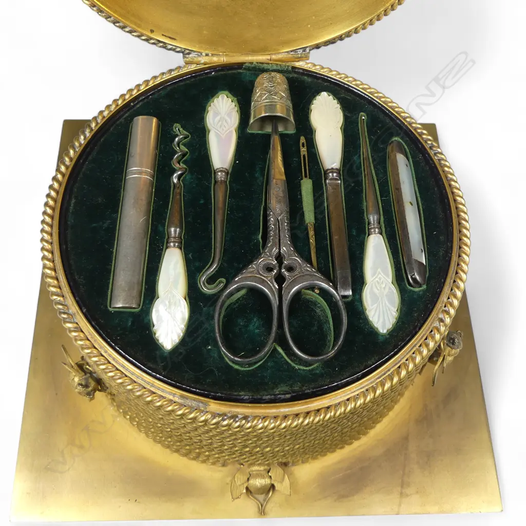 A good mid-Victorian George Betjemann & Sons gilt-metal bee skep sewing box, of classic beehive shape of straw rope twist, surmounted by bees, on a square plinth base with recessed feet. Image 1++