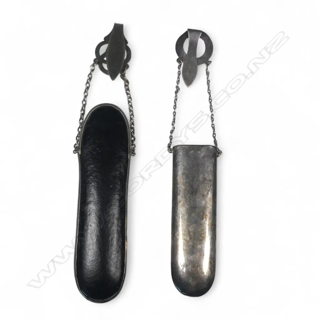 Two spectacle chatelaines, one sliver plate with sterling silver hanger, the other black leather with plated hanger Image 1++