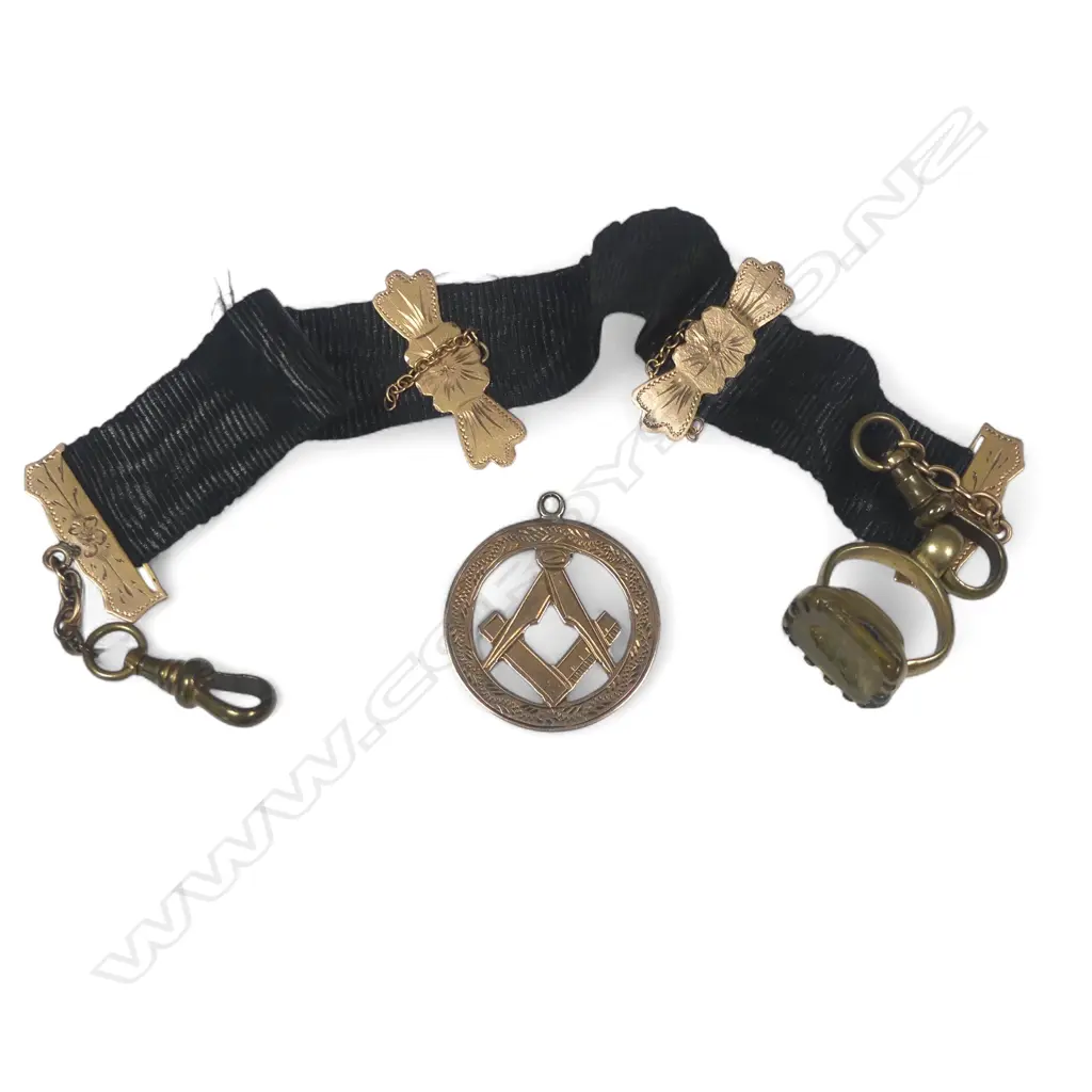 A 9ct gold Masonic medallion fob and a black silk Leontine with 9ct gold mounts, gold plated dog clip and intaglio jewel seal Image 1++