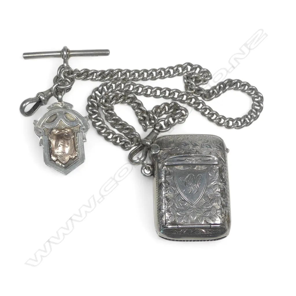 An Edwardian silver combination stamp box / vesta, Birmingham 1907 by John Gilbert, on chain with silver shield medallion fob. Total 65gm Image 1++