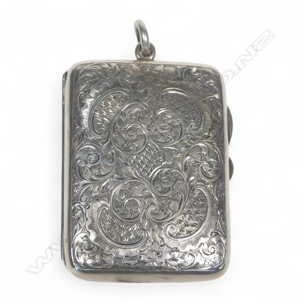 An Edwardian silver combination cigarette case fitted with sovereign and half-sovereign sprung silo holders,  a sprung stamp holder and a space for a small cigarette holder. Image 1++