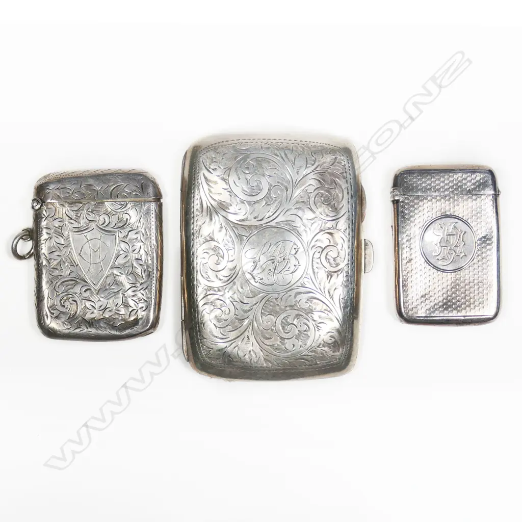 Two sterling silver vesta and a silver cigarette case, all dented. Total 105gm Image 1++