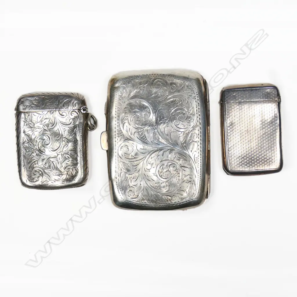 Two sterling silver vesta and a silver cigarette case, all dented. Total 105gm Image 1++