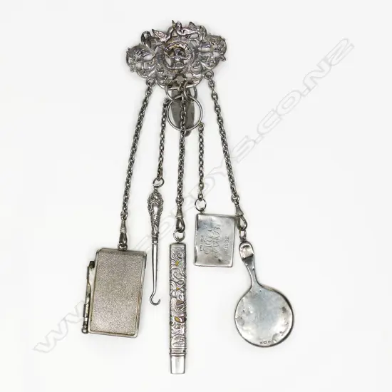 A late Victorian silver chatelaine clip (repaired) with five chained implements: