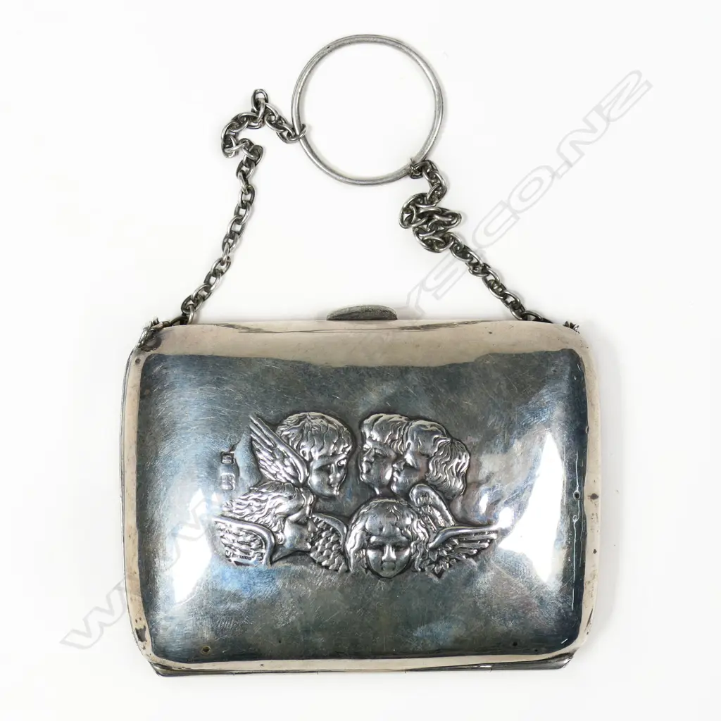 A small Edwardian finger purse, embossed with Reynolds's Angels, Birmingham 1908, swollen rectangular shape, fitted blue silk bellows lining. Total 65gm Image 1++