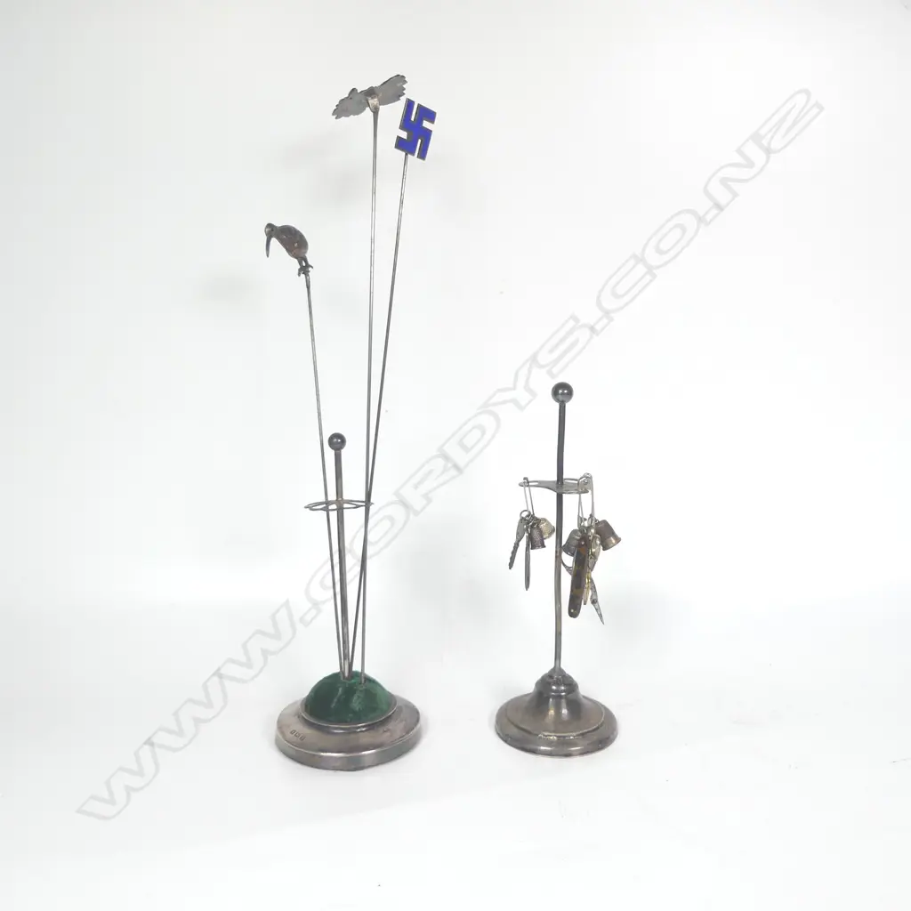 1908 silver hat pin stand, three silver hat pins (kiwi, swaztika and rooster), silver plated stand with mini thimbles and scissors fobs Image 1++