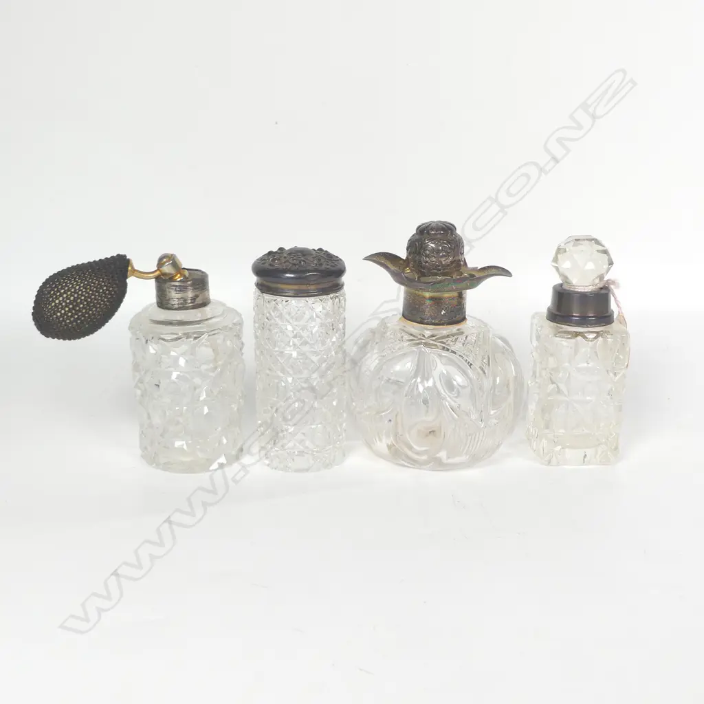 Four cut crystal dressing table bottles with silver mounts, some faults. Image 1++
