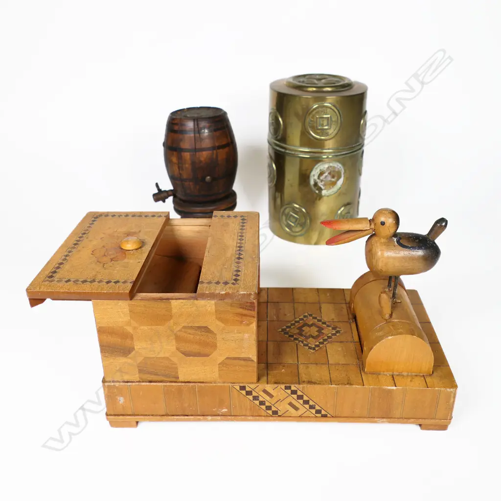An Oriental brass tea caddy canister a novelty 'pecking bird' cigarette box and a novelty barrel shaped vesta whereby depressing the tap causes 12 matches to elevate from the top. H.110mm Image 1++