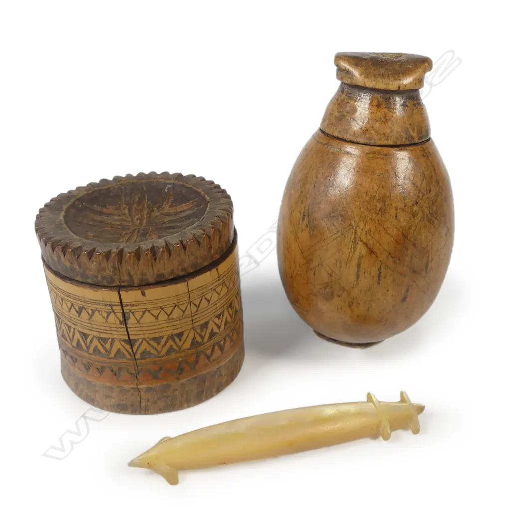 A Timorese tobacco box; a Suluwesi betel box and a Solomon Islands pearl shell lure shank. Image 1++